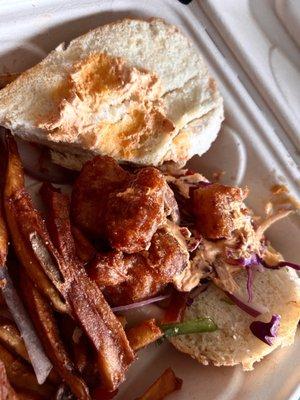 Shrimp po' boy with barely any sauce, burnt tasting shrimp and fries, and some sad old veggies