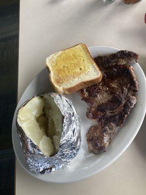 Ribeye steak with huge potato