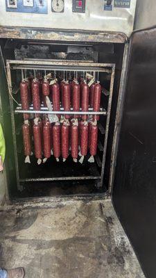 The smoke house which holds about 300 pounds of meat.