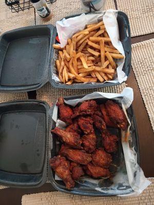 Bucket of wings (about 16) and a bucket of fries.