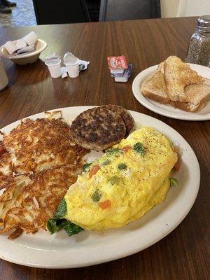 Veggie omelette sausage and potatoes.