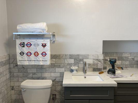 Bathroom remodel with undercount sink.