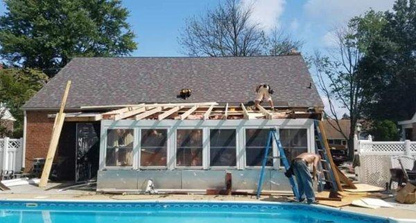 Installed new and shingles framed the flat section  to be able to shingle section