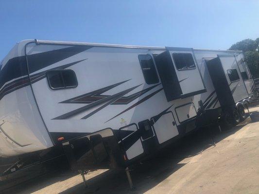 Repairing this large 5th wheel from some water damage. Slide out removed to replace the flooring.