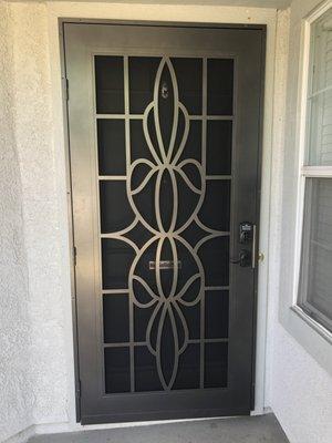 Titan Premium door with laser cut design and custom size. Customer did not want to damage their stucco, so ordered a custom sized door.