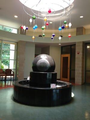 The centerpiece of Women's Physicians of Jacksonville: a giant water fountain ovum topped with light fixture sperm.