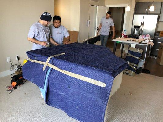 Protecting the piano with moving blankets