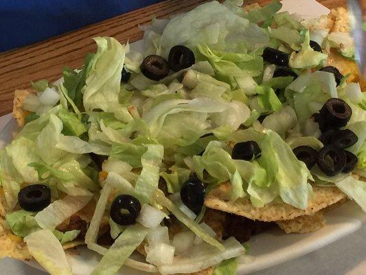 Have you ever seen Napoleon dynamite?  Well, these are nachos.  They have cheese upon which has been melted, these are nachos