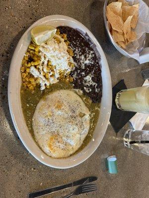 Amazing chicken enchiladas with verde sauce and two fried eggs...the street corn is to die for and the black beans are mouthwatering!