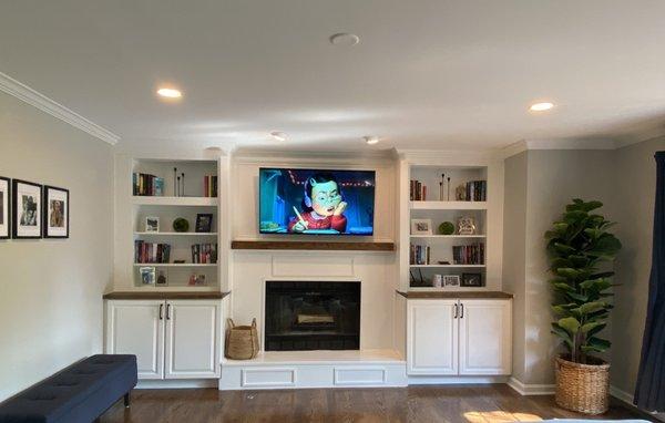 Built ins with custom butcher block top and hand crafted wainscoting.