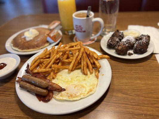 A combo with pancakes, eggs, sausage and bacon. With coffee and Orange Juice. Sub for seasoned fries.