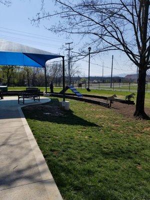 Obstacle course and shaded/covered seating area.