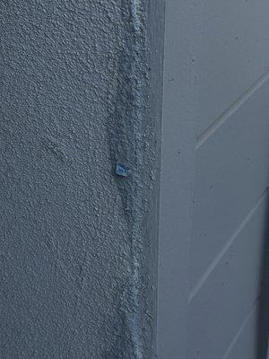 Blue tape stucco over