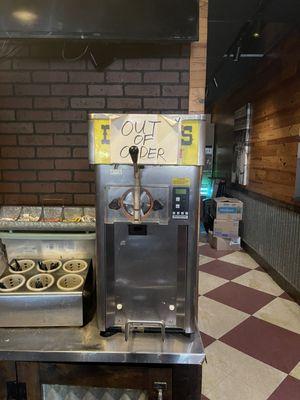 The constantly out of order ice cream machine. Looks like it's been down a while by the looks of the sign.