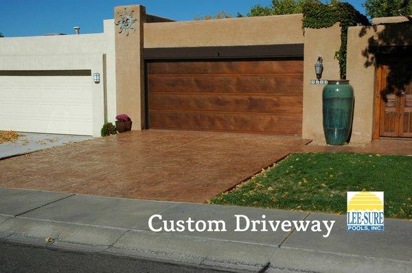 Stamped, highlighted and sealed concrete driveway.