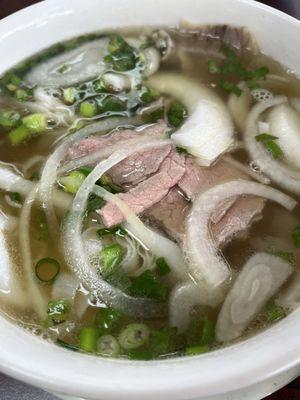 Slap Yo Momma Good Pho with round steak, fatty brisket, tripe, and soft tendon.