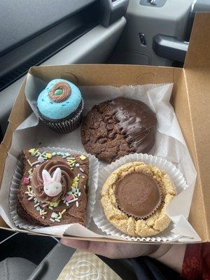 Robin egg cupcake, double chocolate chocolate chip cookie dipped in chocolate , Easter brownie, peanut butter  cookie.