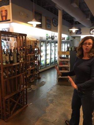 Owner showing wines and beer