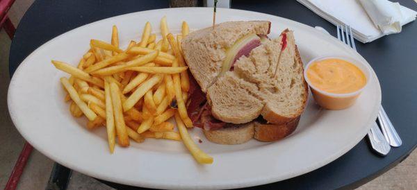 Corned beef on rye with fries.