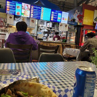 Enjoying my gyro in the food court that I purchased from Palace Kebab.