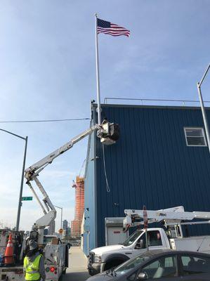 Installed a wall mounted flagpole on a building in LIC NY.