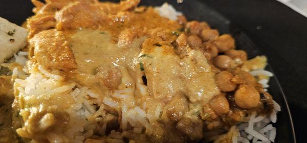 My late of rice, garlic naan, chick peas, chicken, and some kind of veggie balls.