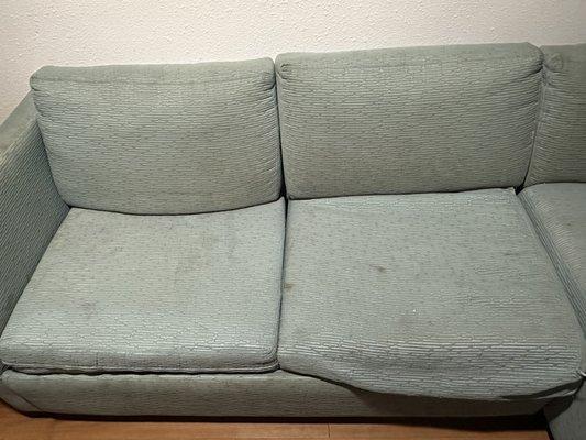 A dirty stained couch