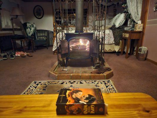 Wood burning fireplace which warms you up while watching movies