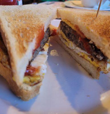 Fried egg, American cheese, scrapple on white toast with ketchup