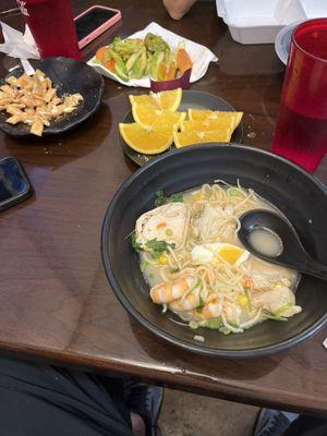 What I couldn't finish of the jumbo shrimp and chicken bowl. The orange slices. What's left of pre-meal snack.