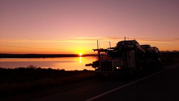 Sunset on the road delivering cars for our customers!