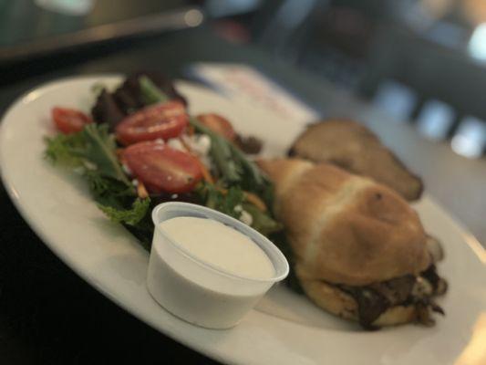 Philly Cheese Steak with a side salad and their house-made Blue Cheese dressing.