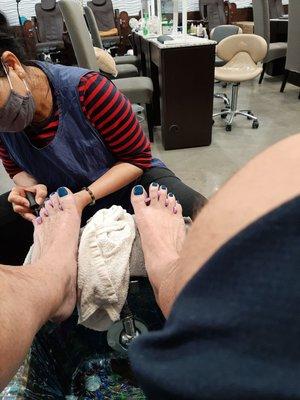 Getting my toes polished , They looked great when they were done