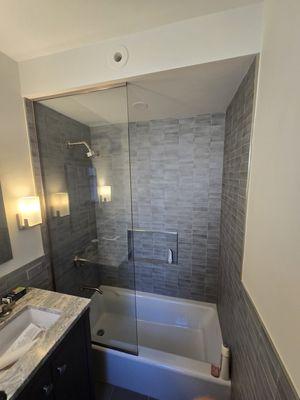 Fixed glass over the bathtub