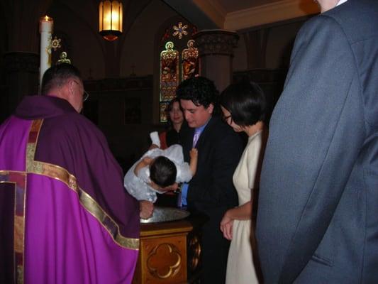 My daughter's baptism by Father Foley at St. James.