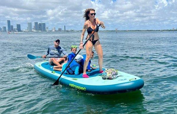 multi people on paddleboard miami beach