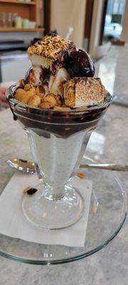 Hot Fudge Sundae (ice cream of your choice, whip cream, a cherry, and peanuts)