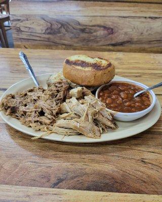 Pulled pork, chicken twice baked potatoe and bbq beans