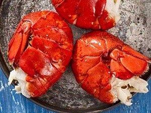 Lobster tails steamed on grill in foil packets