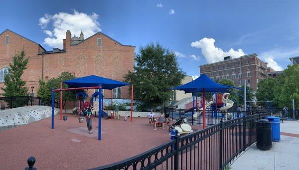 Two playground areas with swings, seesaw and slides