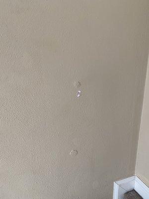 2 holes in wall