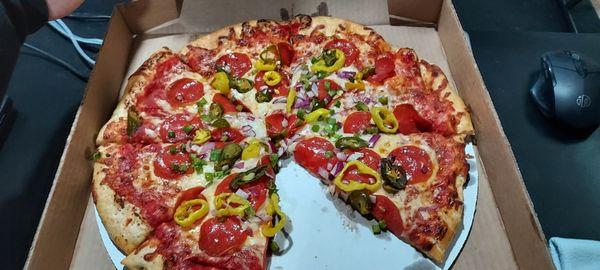 pepperoni, onions, bell peppers, banana peppers and jalapenos.
 Fantastic?
 makes me very happy.