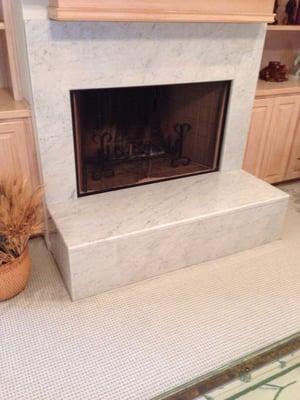 Marble fireplace done by planett granite still looking great after 6 years,