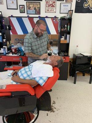 Hot towel shave in progress