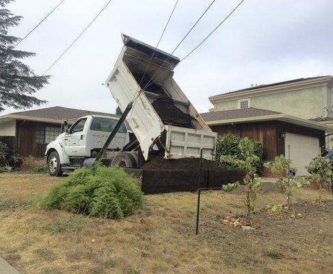 4 cubic yard of gardening soil dumped right where we need it.