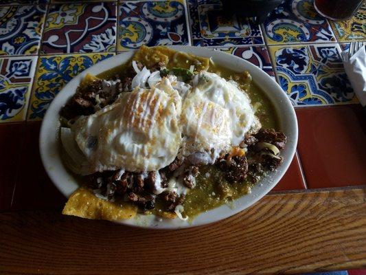 Chilaquales con asada y juevos (with steak and eggs)