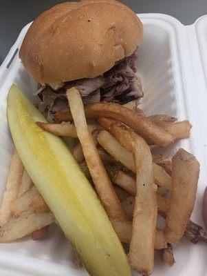 Beef sandwich with deliciously seasoned fries.