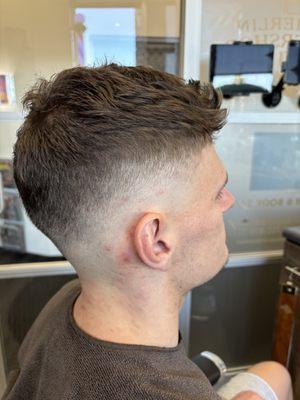 High 0' fade with textured crown.