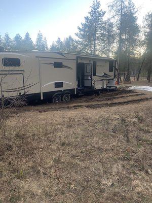 Fifth wheel and truck stuck in mud