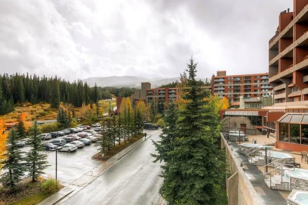 Hot tub area with a view of building four at Beaver Run Resort. Peak 9 and 10 of Breckenridge's ski resort in the background.